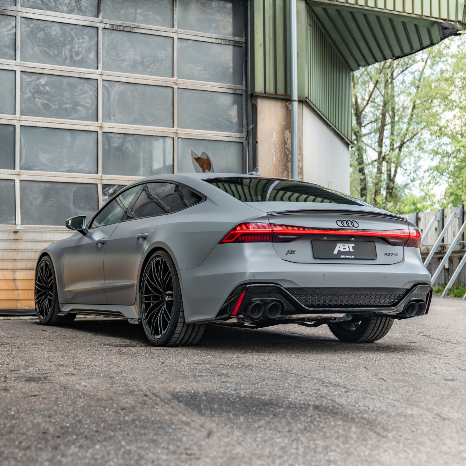 grey RS7-S from the side rear view in front of the hall