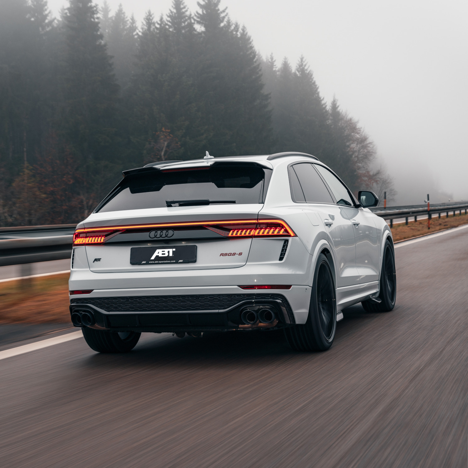 White RSQ8-S from the rear view on the motorway